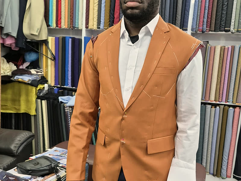 A guest in a tailored waistcoat over a white shirt