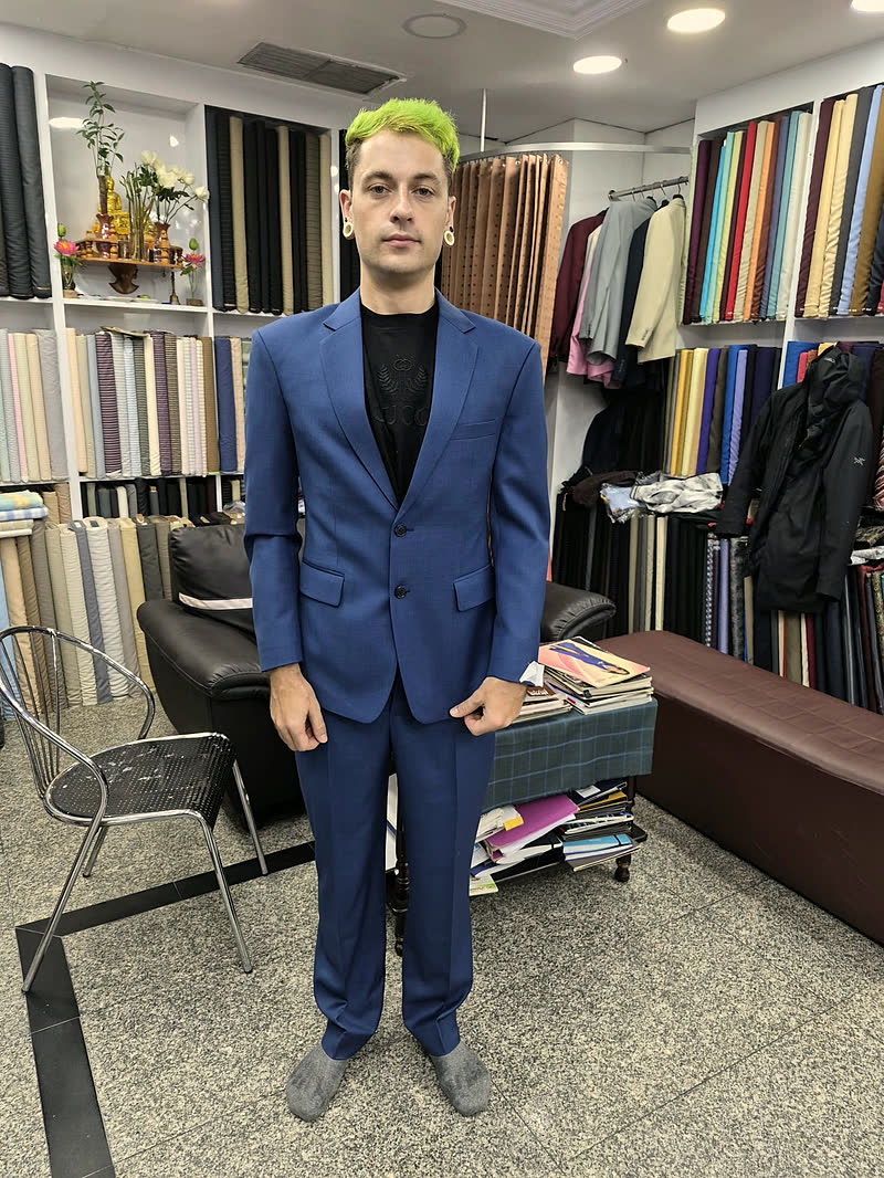 A guest in a bright blue suit