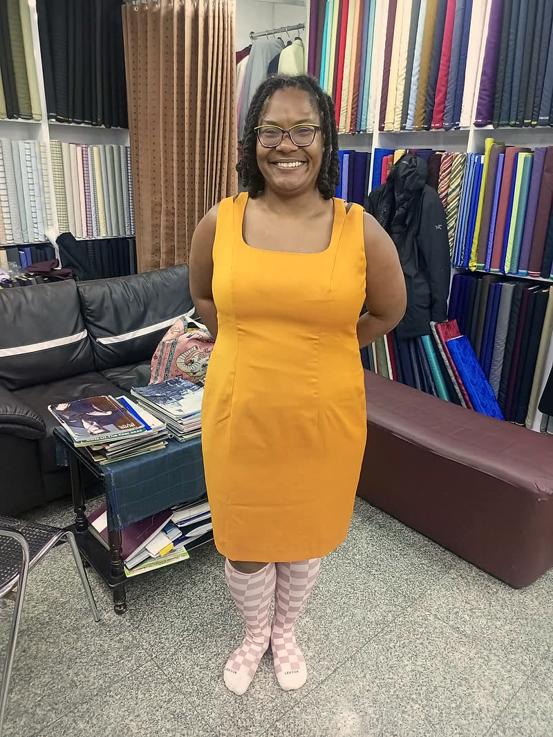 A guest in a made-to-measure yellow dress